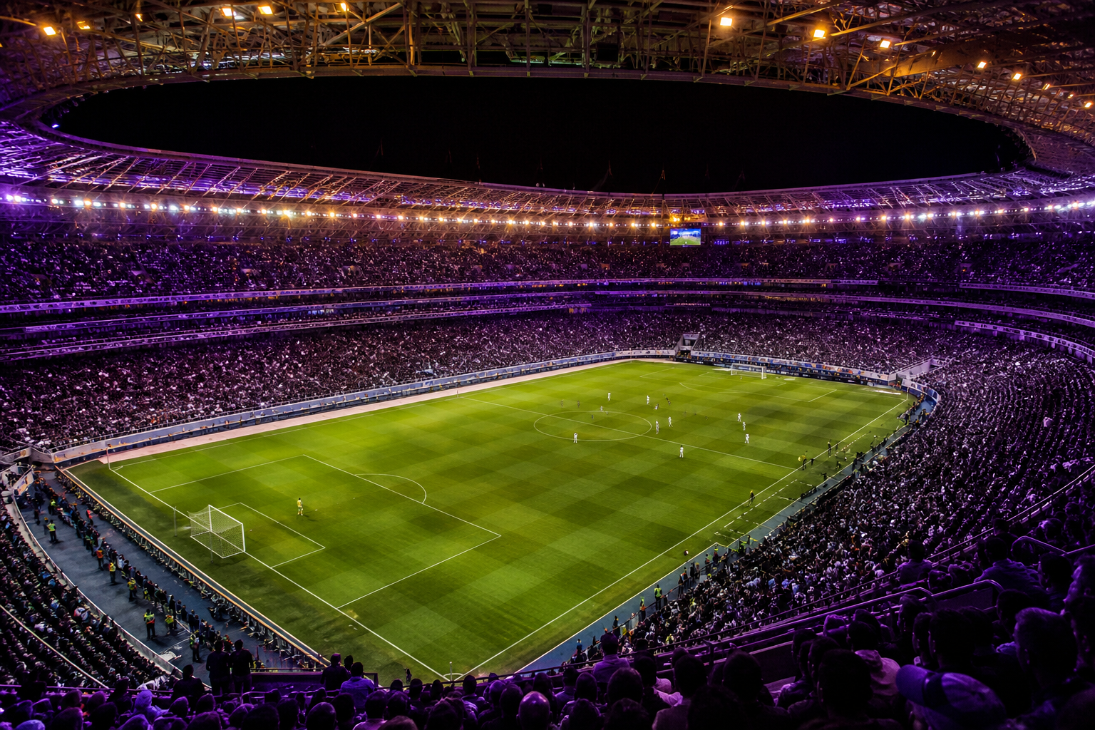 Estádio iluminado durante partida de futebol